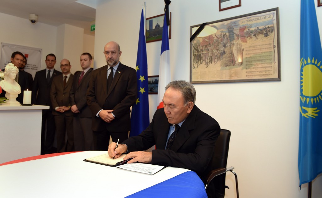 President Nursultan Nazarbayev signs the book of condolences at the French embassy in Astana Nov. 16.