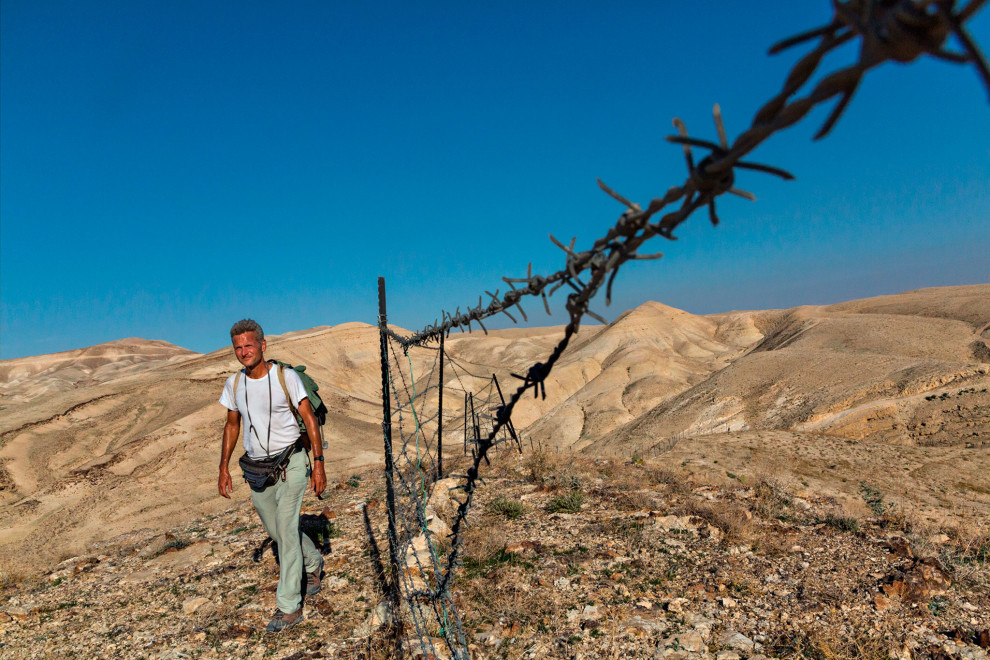 Paul Salopek reaches his first fence or wall while walking through the Kidron Valley in the West Bank, Palestinian territories, towards Bethlehem.