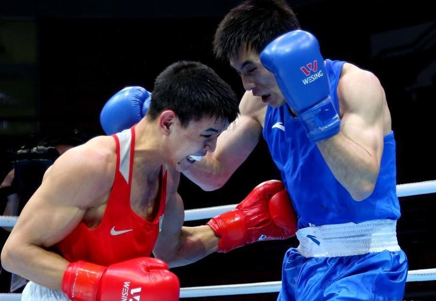 Zhussupov Ablaikhan (L) during semifinal of men's 64kg category, Photo credit: news.xinhuanet.com