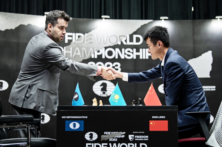 China's Ding Liren, left, and Russia's Ian Nepomniachtchi shake hands prior  to their FIDE World Chess Championship in Astana, Kazakhstan, Saturday,  April 29, 2023. Ian Nepomniachtchi and Ding Liren are facing off